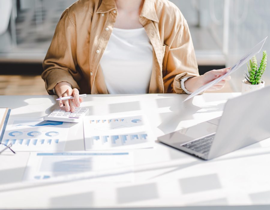 Portrait of a business woman working on a tablet computer in a modern office. Make an account analysis report. real estate investment information financial and tax system concepts